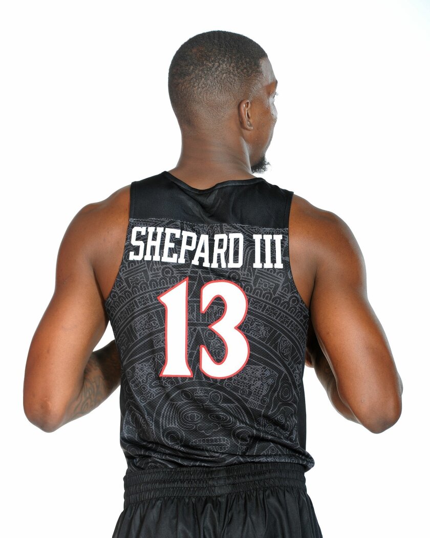 Winston Shepard models SDSU's new road basketball jerseys, with the Aztec calendar on the back.