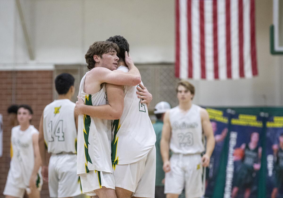 Edison's Quinn Delaney, left, and Dylan Hugues hug after beating Mission Bay.  