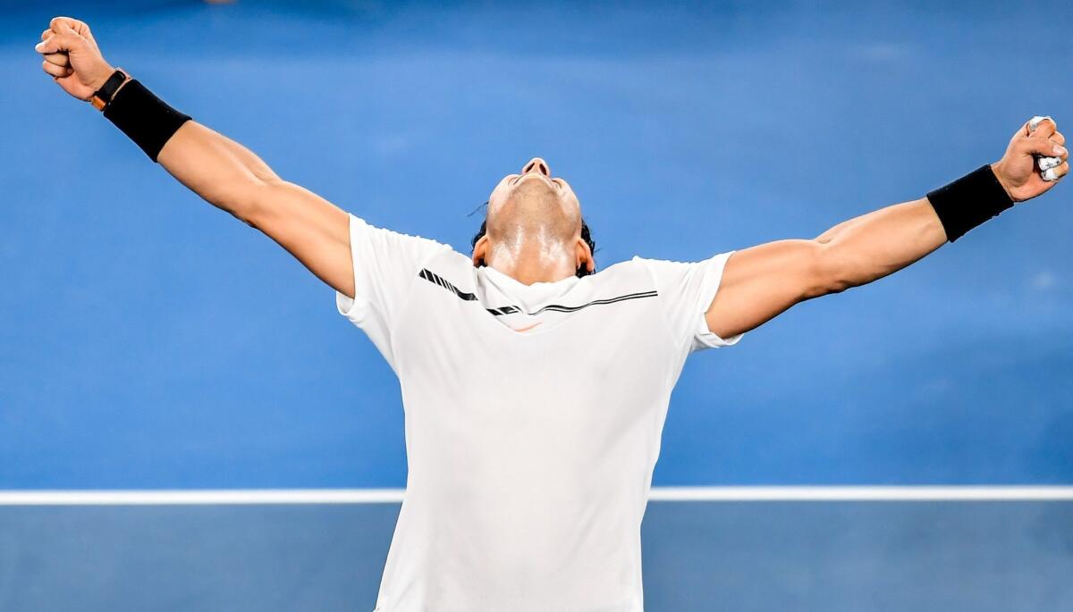 Rafael Nadal celebrates after defeating Grigor Dimitrov in a nearly five-hour semifinal match at the Australian Open.