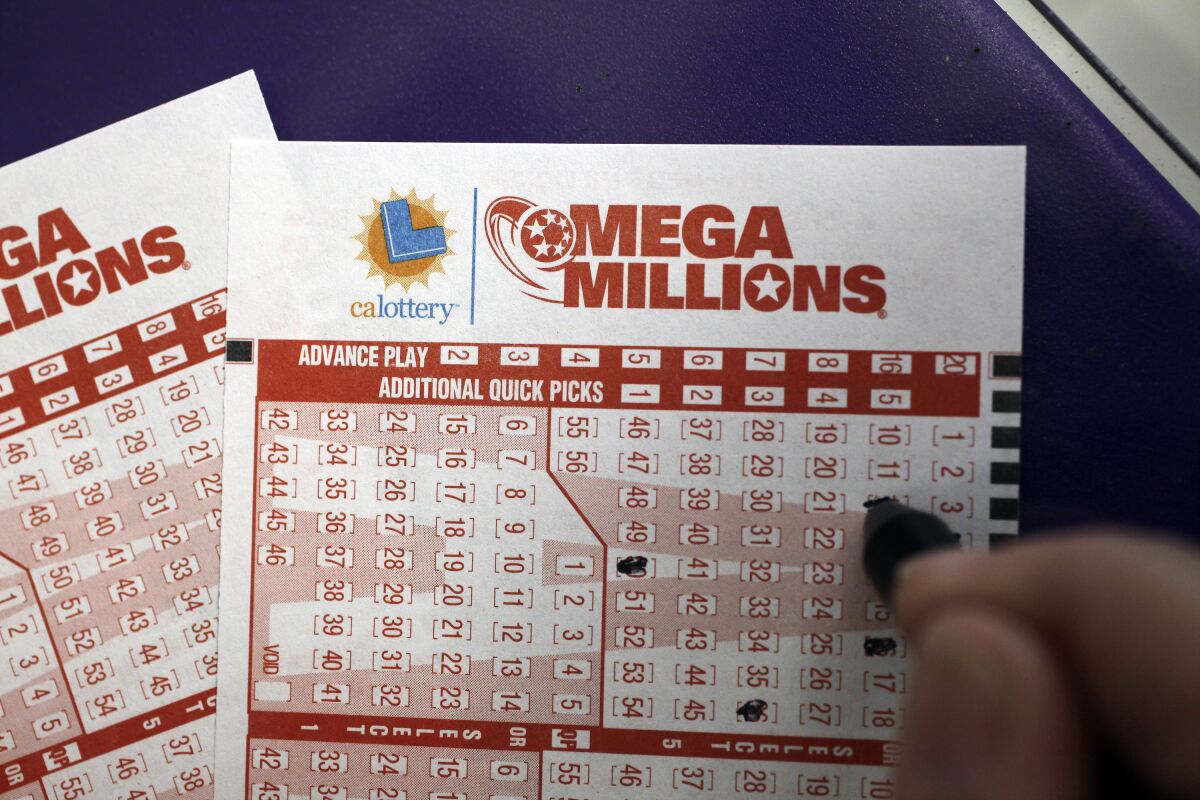 A customer fills out a lottery ticket in Palo Alto, Calif., on March 30, 2012 