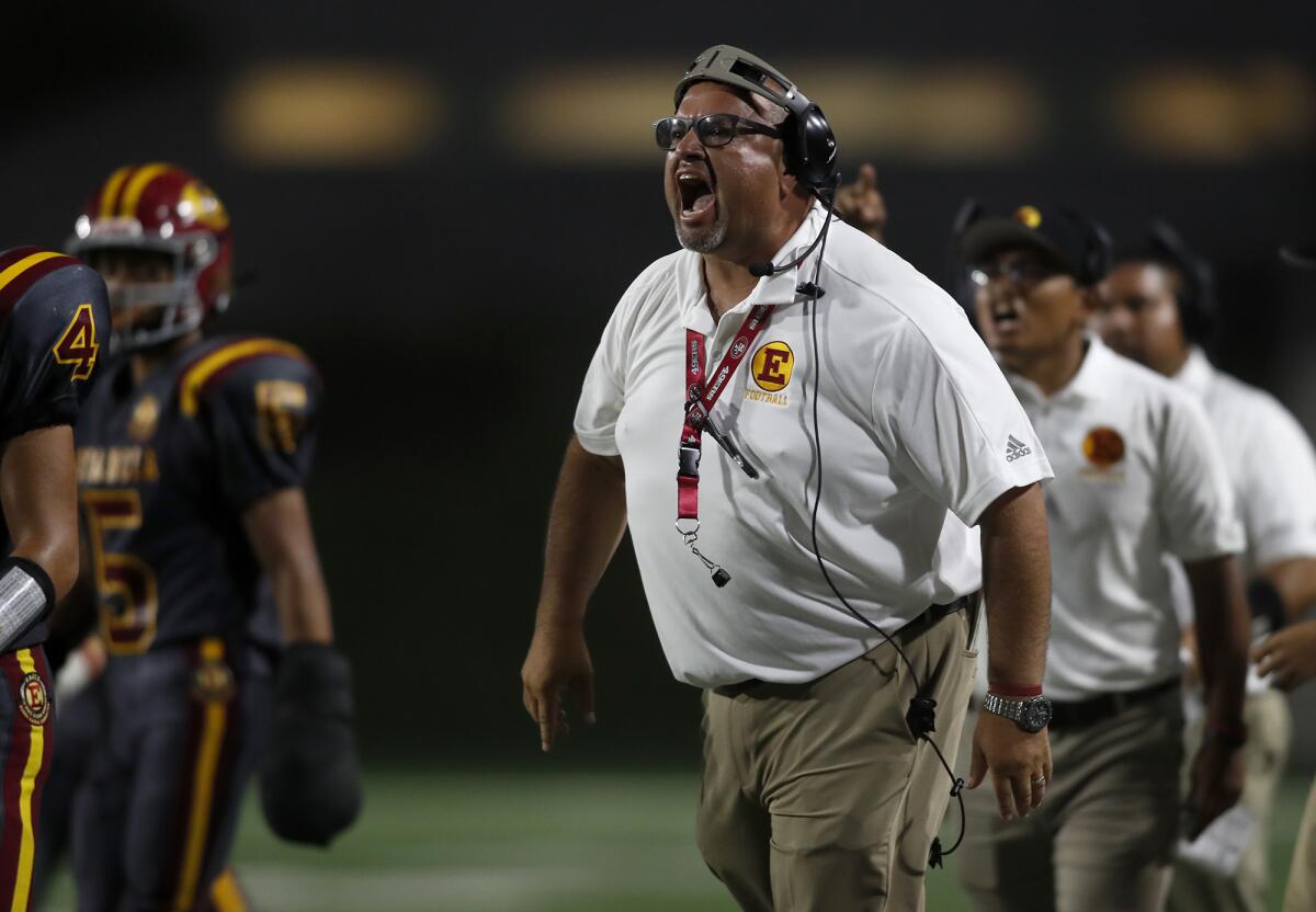 Estancia coach Mike Bargas, seen instructing his players against Santiago on Sept. 12, and his Eagles dropped their fourth straight game on Thursday, losing 24-14 to Calvary Chapel.