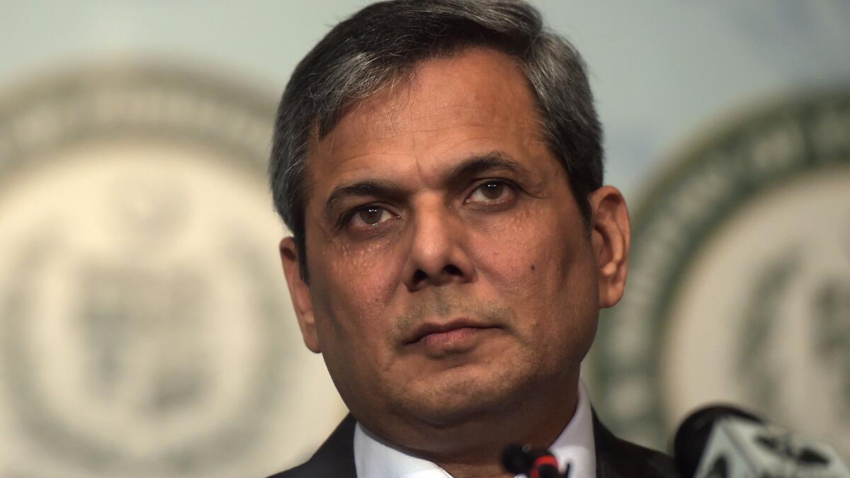 Nafees Zakaria, spokesman for the Pakistan Foreign Ministry, listens at a news conference in Islamabad. Prime Minister Nawaz Sharif condemned the "naked aggression of Indian forces."