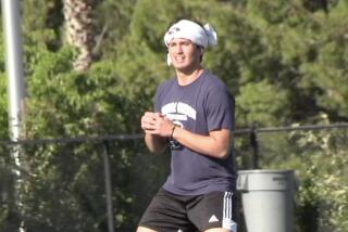 Quarterback Chayden Peery of Sierra Canyon practicing throwing without a ball last June when balls were not permitted.