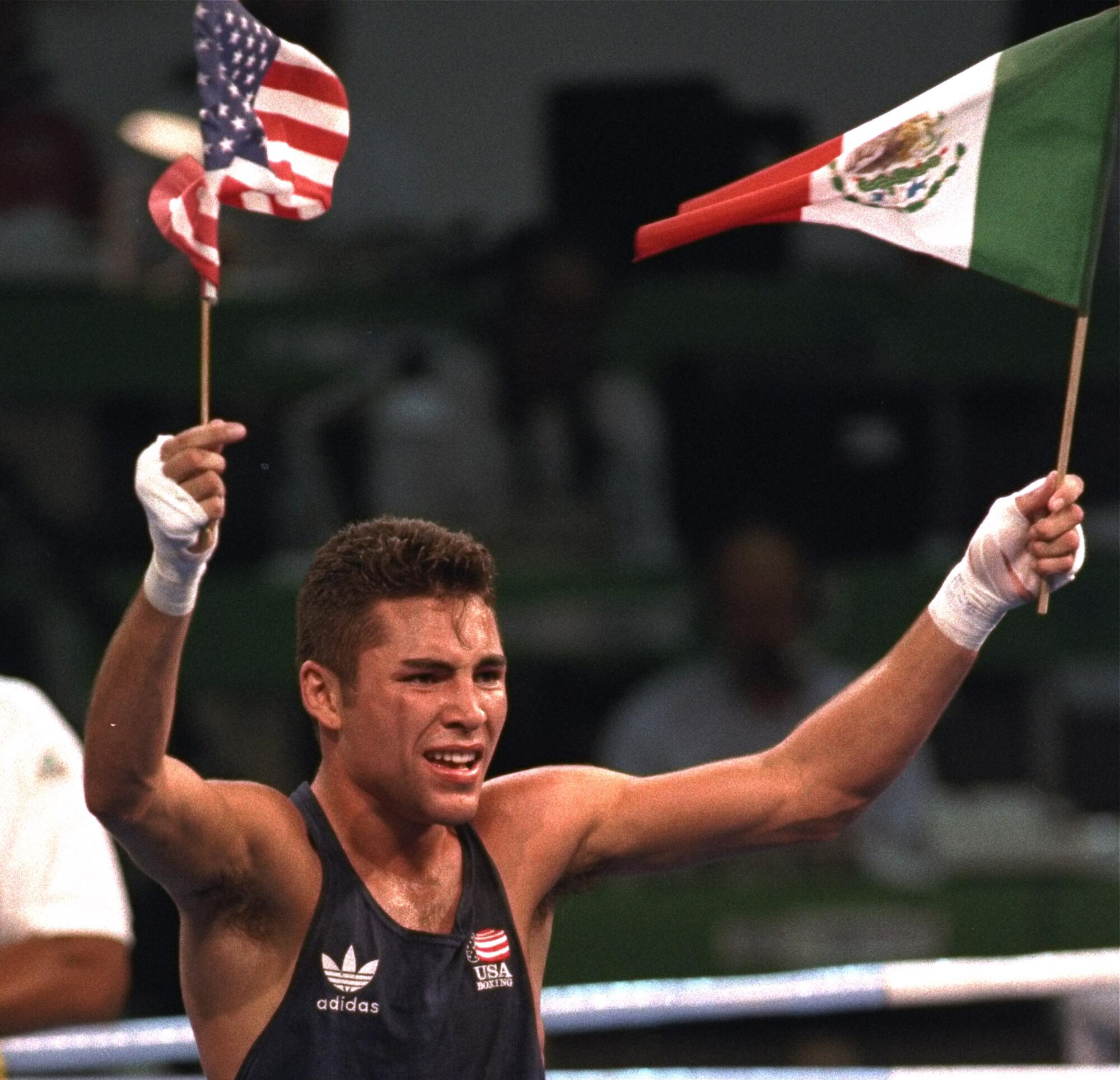 Oscar De Le Hoya waves the U.S. and Mexican flags 