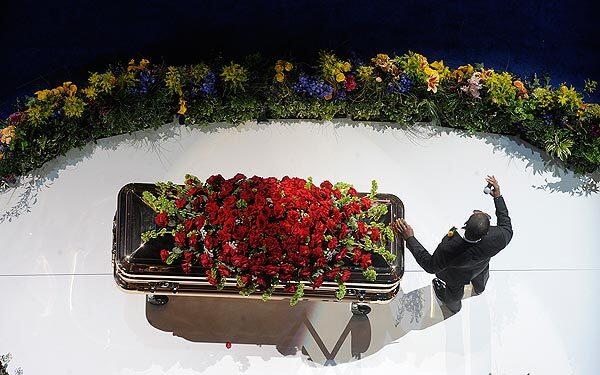 R&B star Usher, rests his hand of Michael Jackson 's coffin during his rendition of Michael Jackson 's 'Gone Too Soon' during Michael Jackson memorial at Staples Center. Wally Skalij / Los Angeles Times