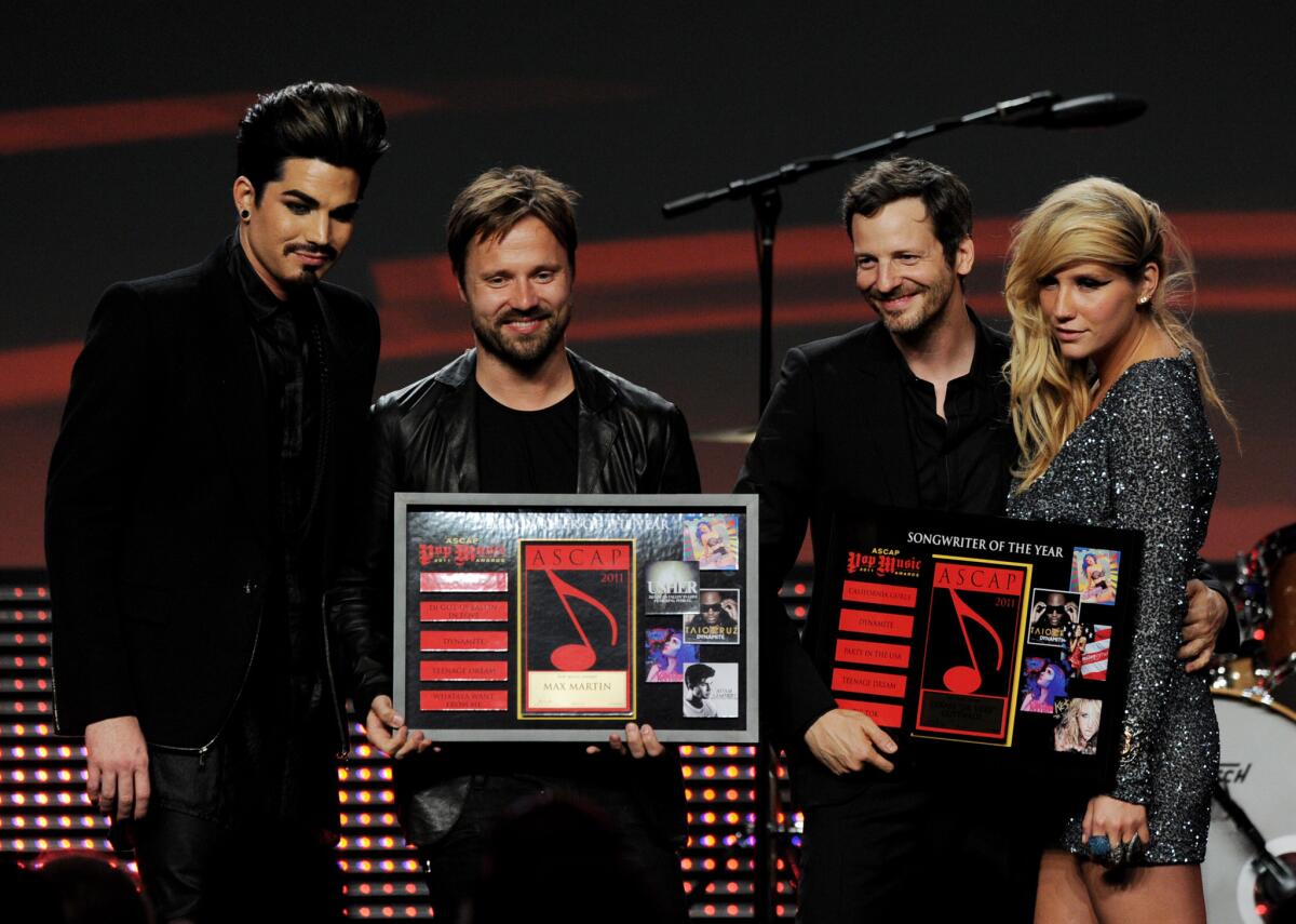 Lukasz "Dr. Luke" Gottwald and Kesha are shown onstage at the ASCAP Pop Music Awards in Los Angeles in 2011.