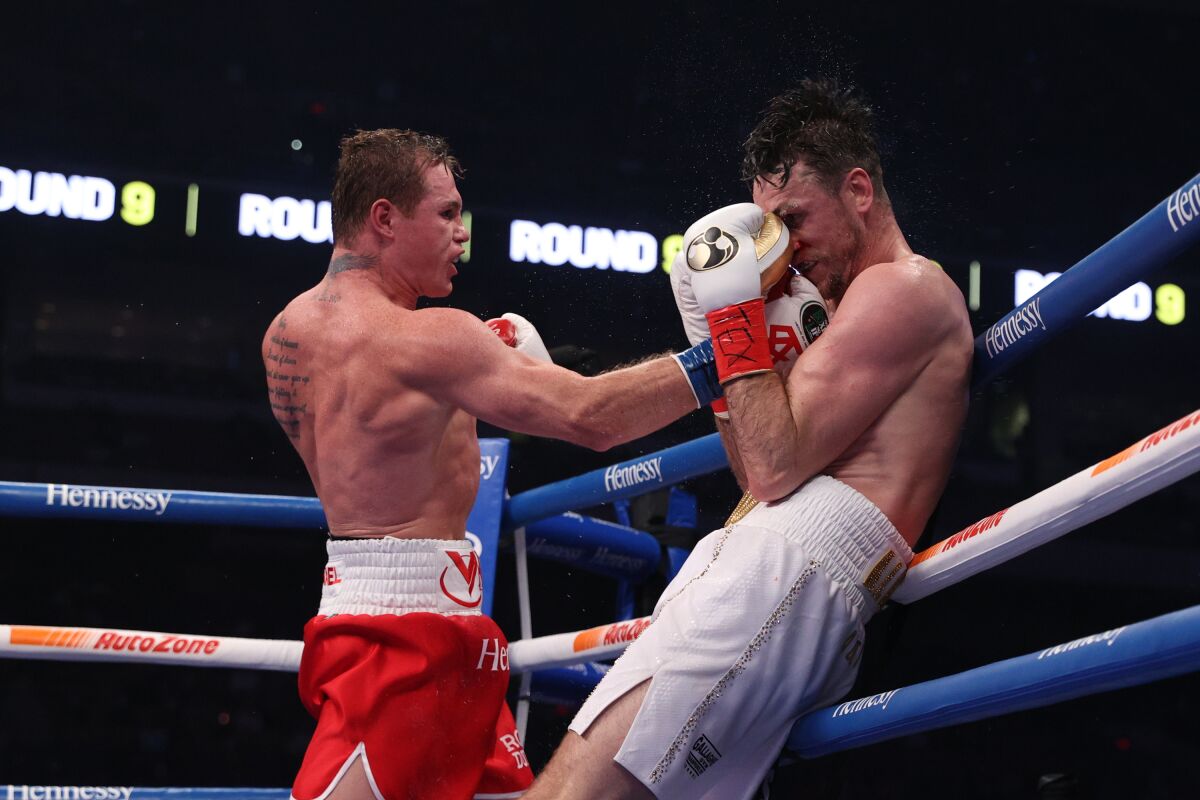 Canelo Alvarez connects with a right to the head of Callum Smith.