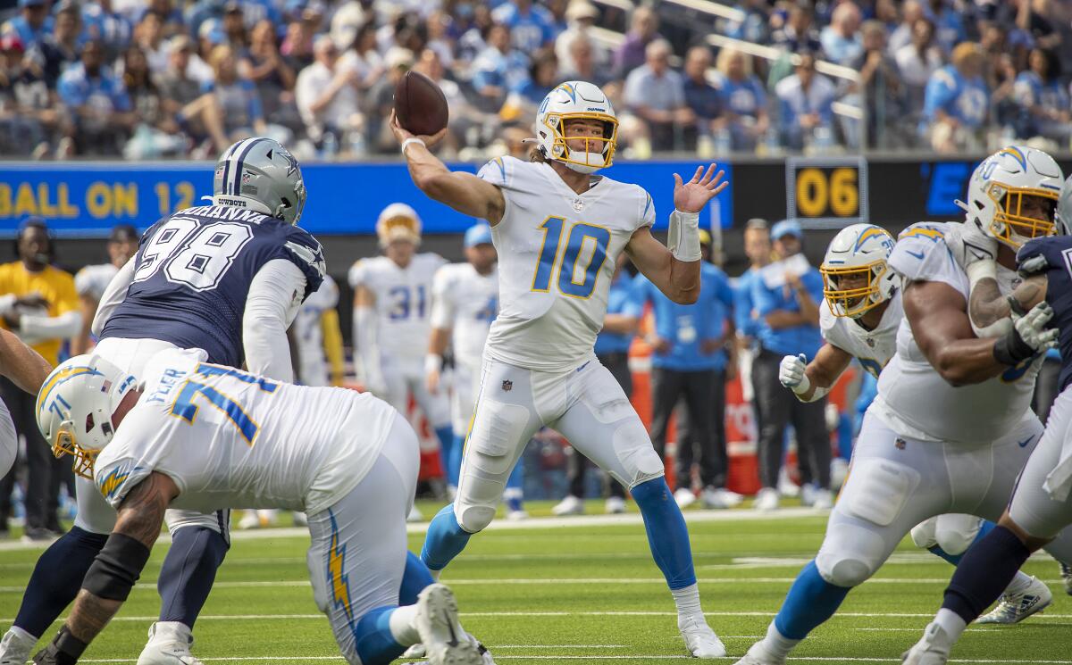 Chargers quarterback Justin Herbert passes during a loss to the Dallas Cowboys on Sept. 19, 2021.