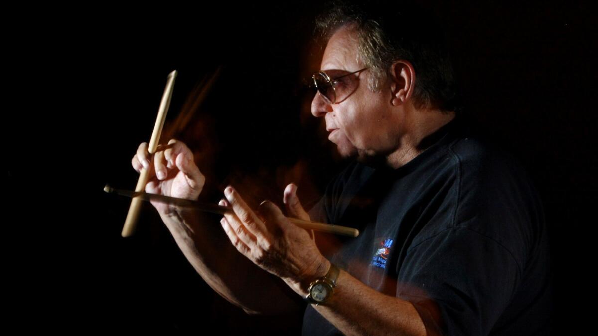 Hal Blaine, photographed in 2003, plays with his sticks in his home in Palm Desert.