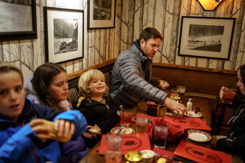 Carson Palmer takes his children, from left, Fletch, Bries, Carter and Elle out to dinner in Ketchum, Idaho, on Dec. 10.