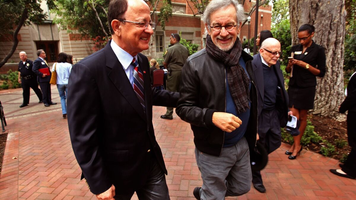 Director and USC trustee Steven Spielberg, right, with C.L. Max Nikias in 2014.