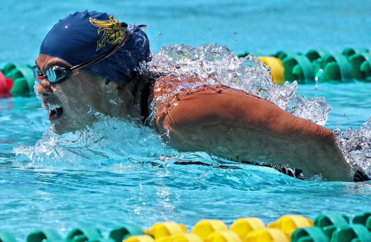 Marina High's Sage Matsushima won the girls' 100-yard butterfly in the Wave League swimming finals at Golden West College in Huntington Beach on Thursday.