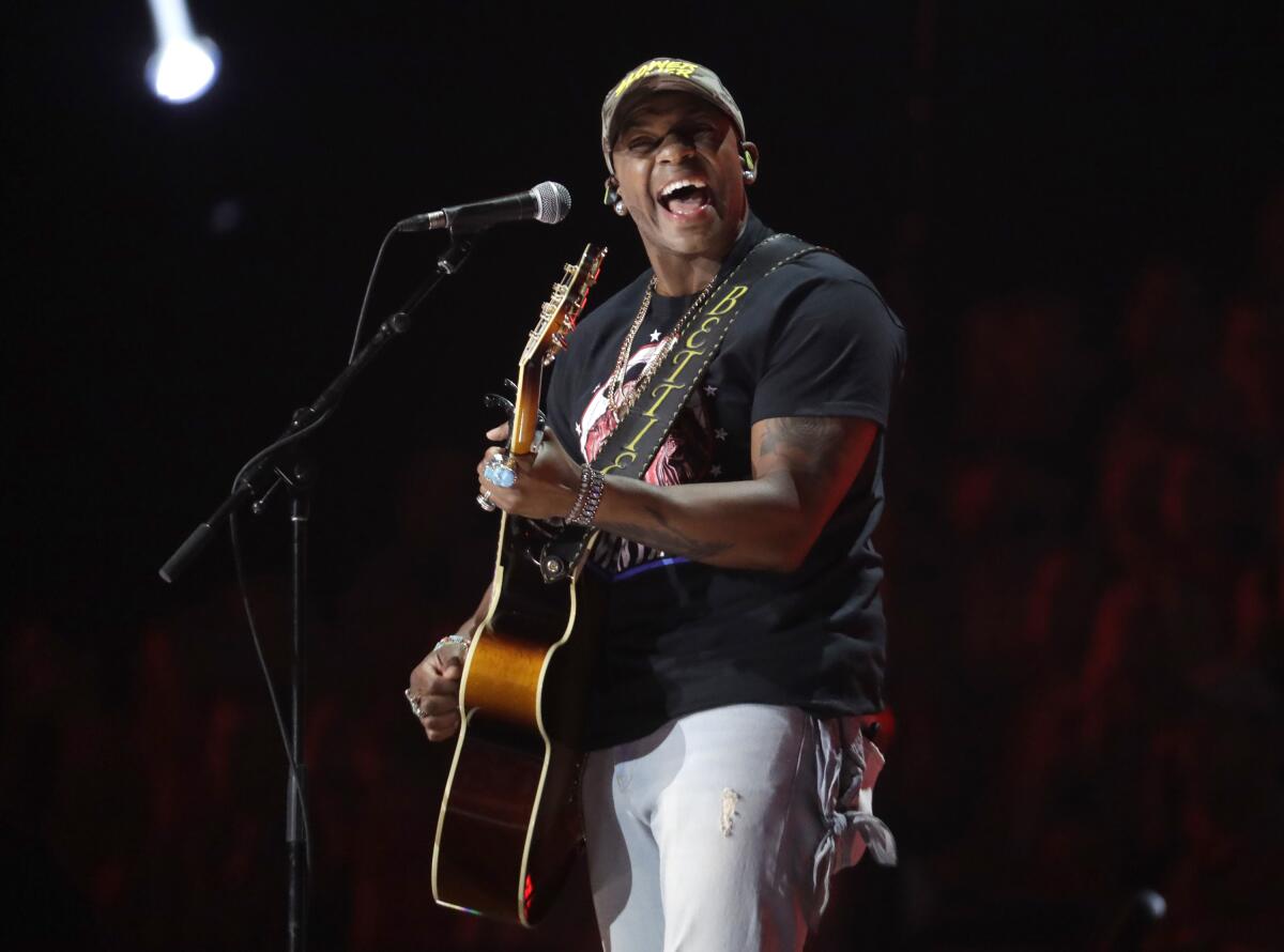FILE - Jimmie Allen performs "Best Shot" at the CMT Music Awards in Nashville, Tenn. on June 5, 2019. Allen will be introduced today as singer of the national anthem prior to the May 30 Indianapolis 500 at Indianapolis Motor Speedway. (AP Photo/Mark Humphrey, File)