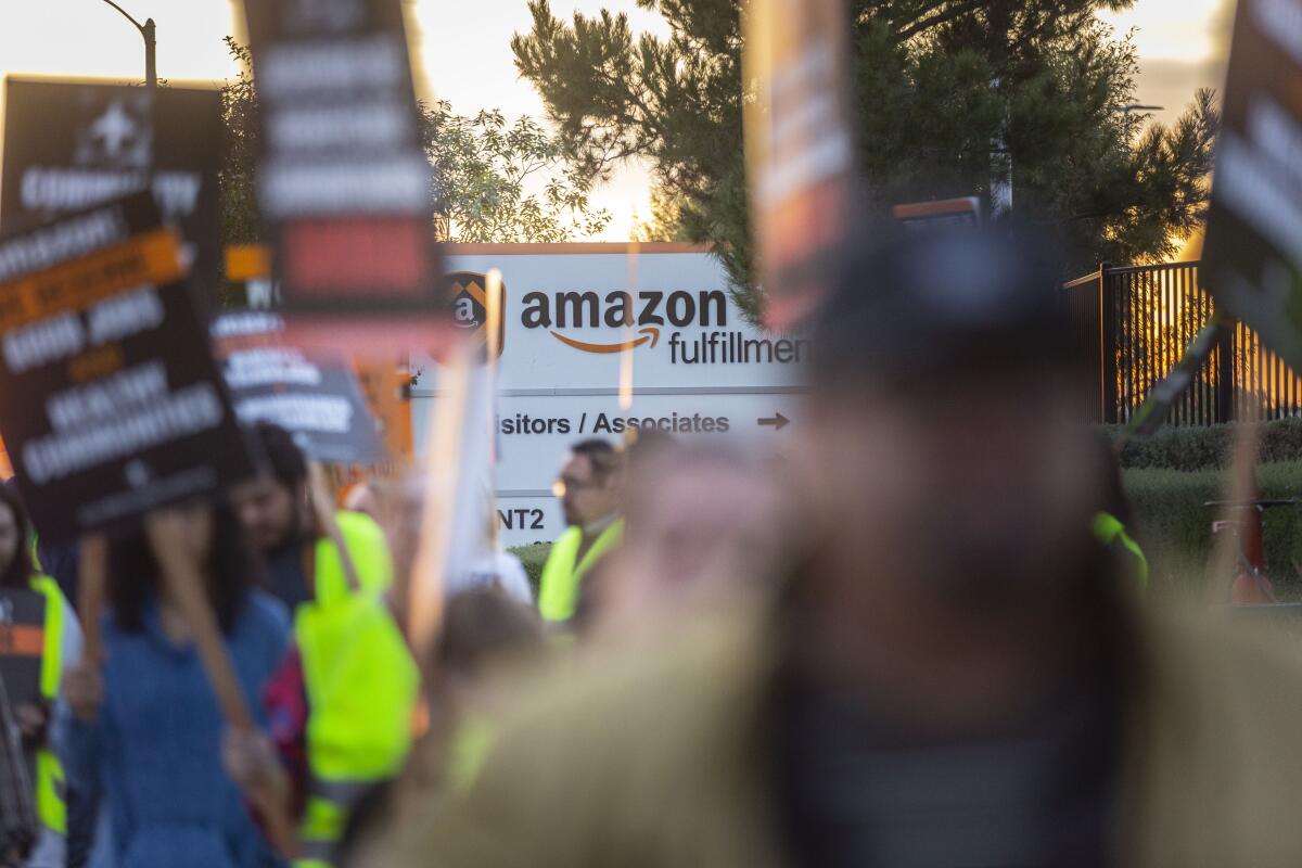 The San Bernardino rally called attention to the disparity between Amazon chief Jeff Bezos' riches and the $15 an hour his company pays many employees.