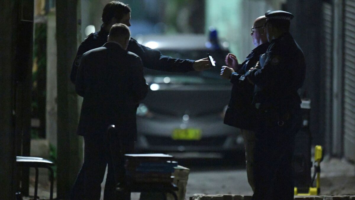 Australian police work in Sydney's Surry Hills suburb on July 29, 2017. Law enforcement officials raided properties in several Sydney suburbs and arrested four people on suspicion of plotting a terrorist attack.