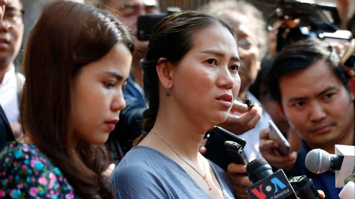 Pan Ei Mon, right, and Chit Su Win, wives of jailed Reuters journalists Wa Lone and Kyaw Soe Oo, talk to reporters outside a court in Yangon, Myanmar, on Jan. 11.