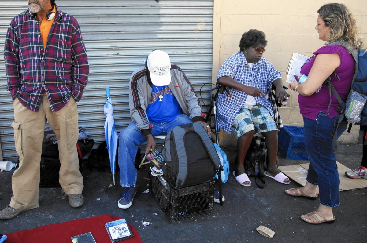 Dr. Susan Partovi, right, makes her rounds on skid row in downtown Los Angeles. She has worked in homeless medicine for 12 years.