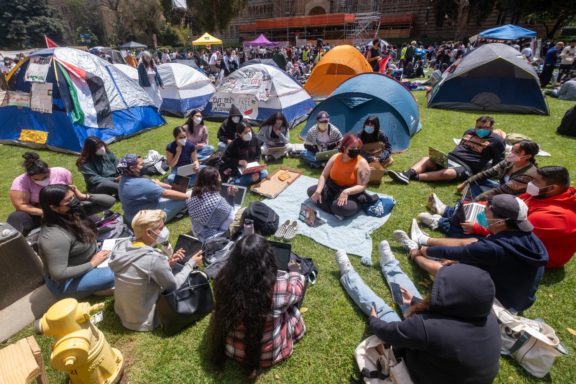 Pro-Palestine protesters gather at an encampment on the campus of UCLA.