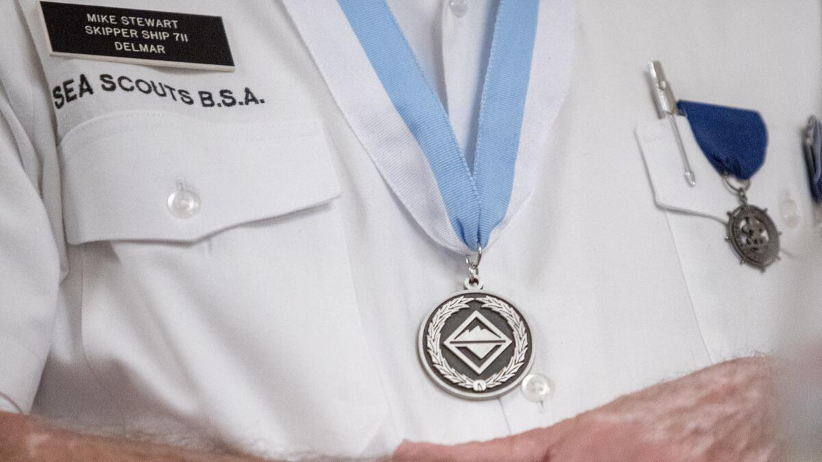 Mike “Skip” Stewart, 80, wears the Sea Scout Leadership Award he received Wednesday.