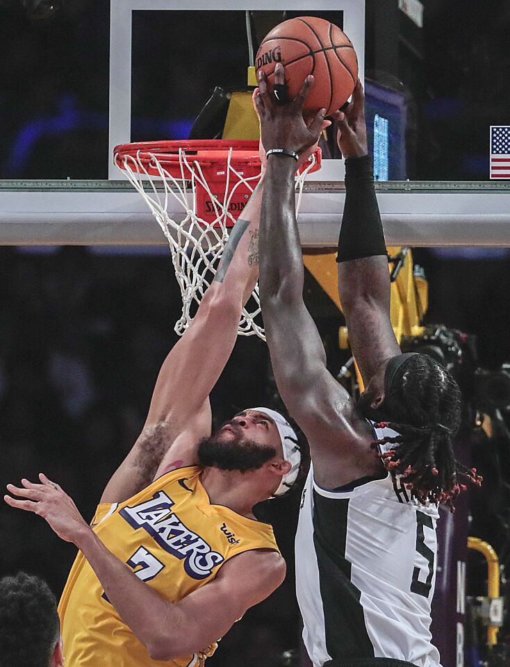 Lakers center JaVale McGee blocks a shot by Clippers center Montrezl Harrell during the first half.