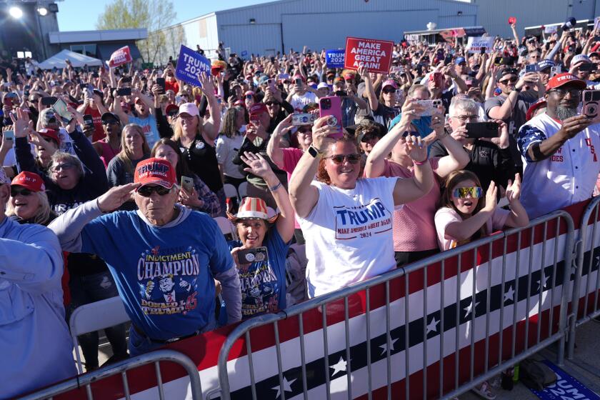 Supporters react as Republican presidential candidate former President Donald Trump speaks at a campaign rally in Freeland, Mich., Wednesday, May 1, 2024. (AP Photo/Paul Sancya)