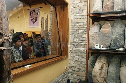 Schoolchildren look at mummies at the museum in Leymebamba. The Chachapoya culture revered ancestors.