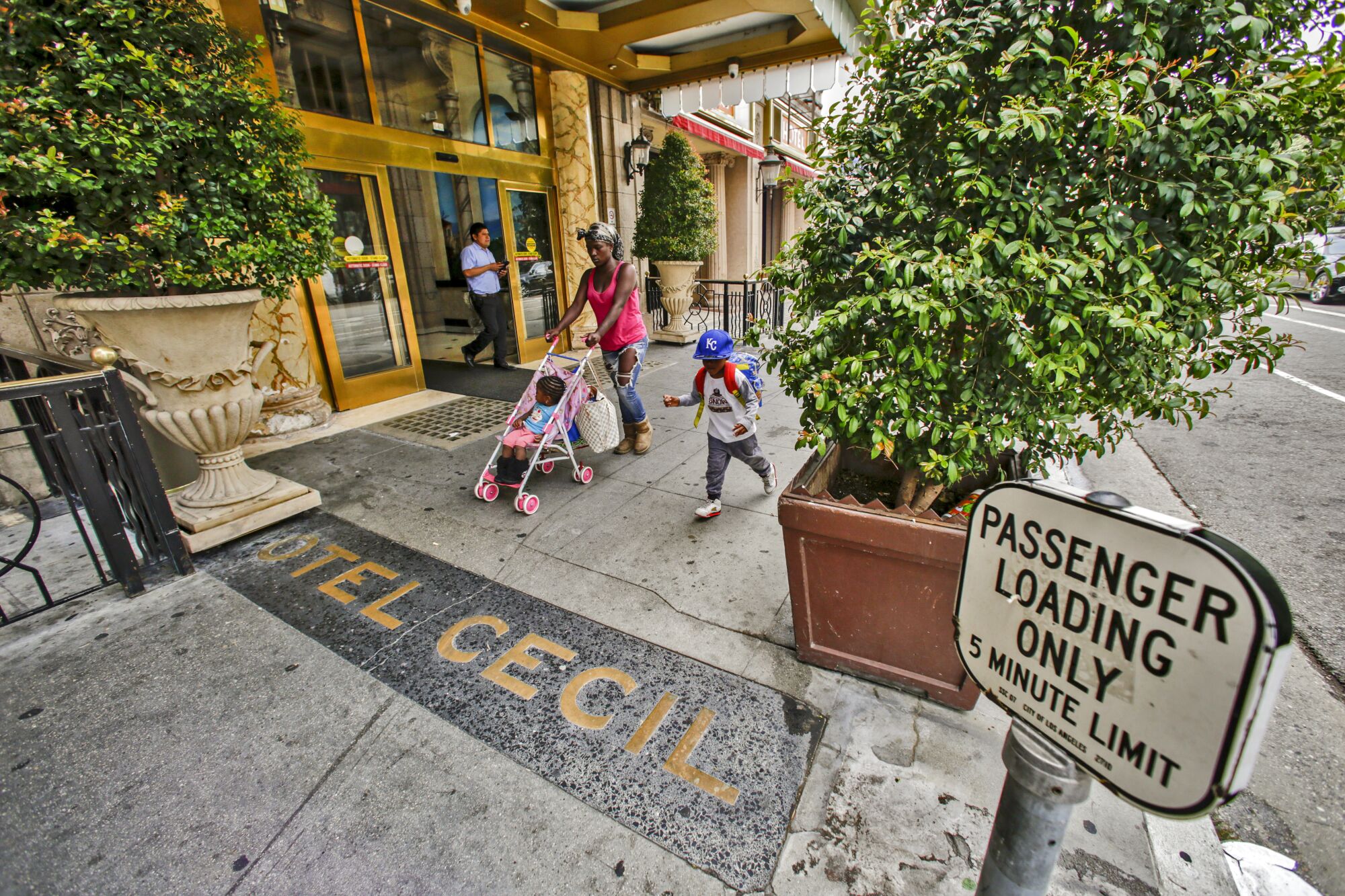 People walk by the Cecil Hotel in downtown Los Angeles.
