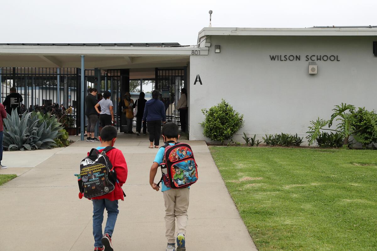 Students walk to class at Wilson Elementary School on Friday, June 3, 2022 in Costa Mesa.