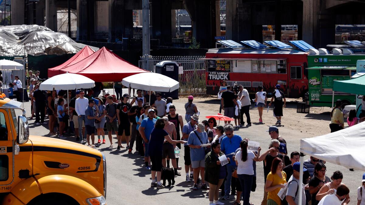 People wait in line to own a piece of the 6th Street Bridge.