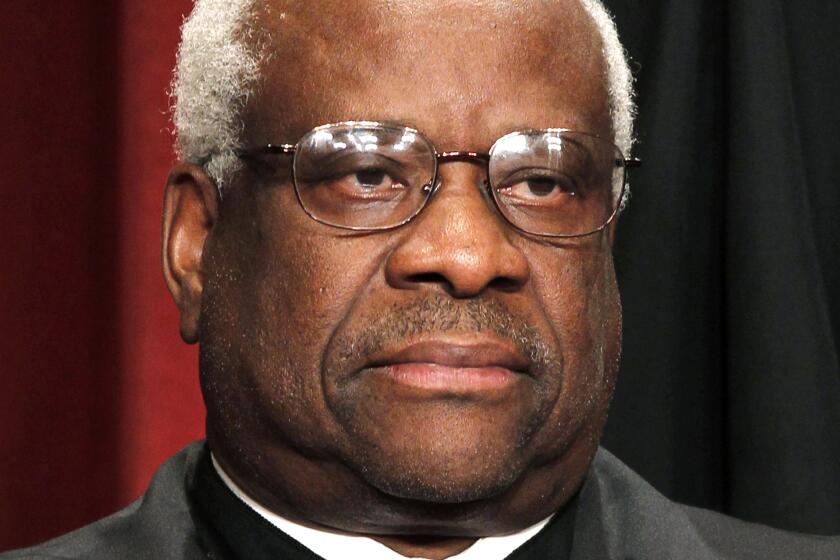 FILE - In this Oct. 8, 2010 file photo, Associate Justice Clarence Thomas is seen during the group portrait at the Supreme Court Building in Washington. Liberals and Democrats in Congress want Justice Thomas off the health care case. Conservative interest groups and Republican lawmakers say it's Justice Elena Kagan who should sit it out. Neither justice is budging — the right decision, according to many ethicists and legal experts. (AP Photo/Pablo Martinez Monsivais, file)