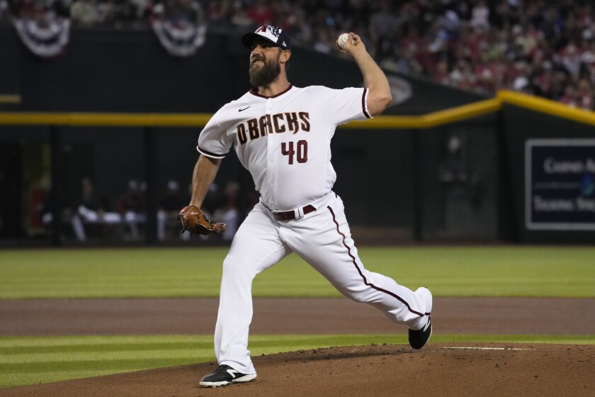 Arizona Diamondbacks pitcher Madison Bumgarner throws against the San Francisco Giants in the first inning during a baseball game, Monday, July 4, 2022, in Phoenix. (AP Photo/Rick Scuteri)