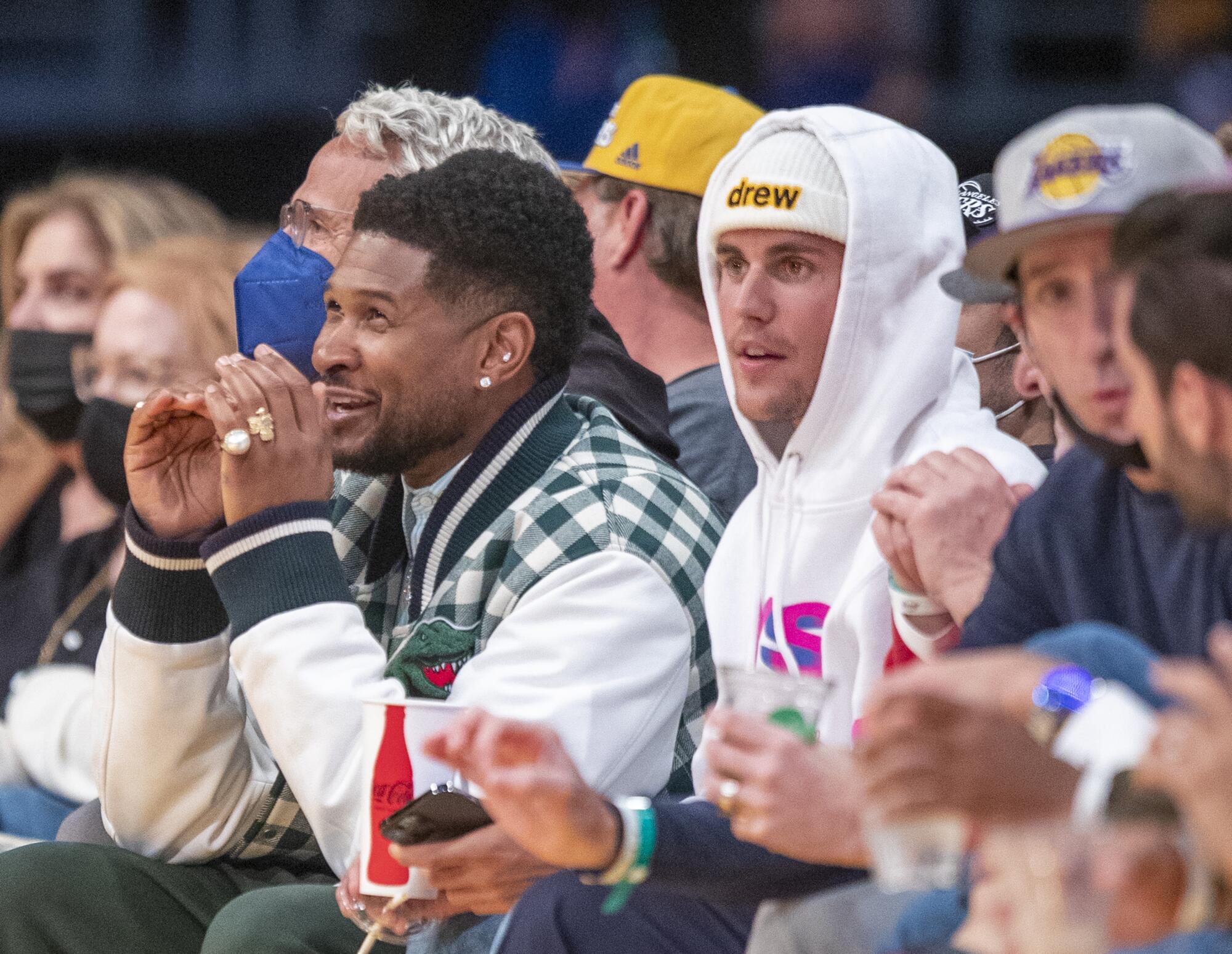 Usher and Justin Bieber in the crowd at Staples Center
