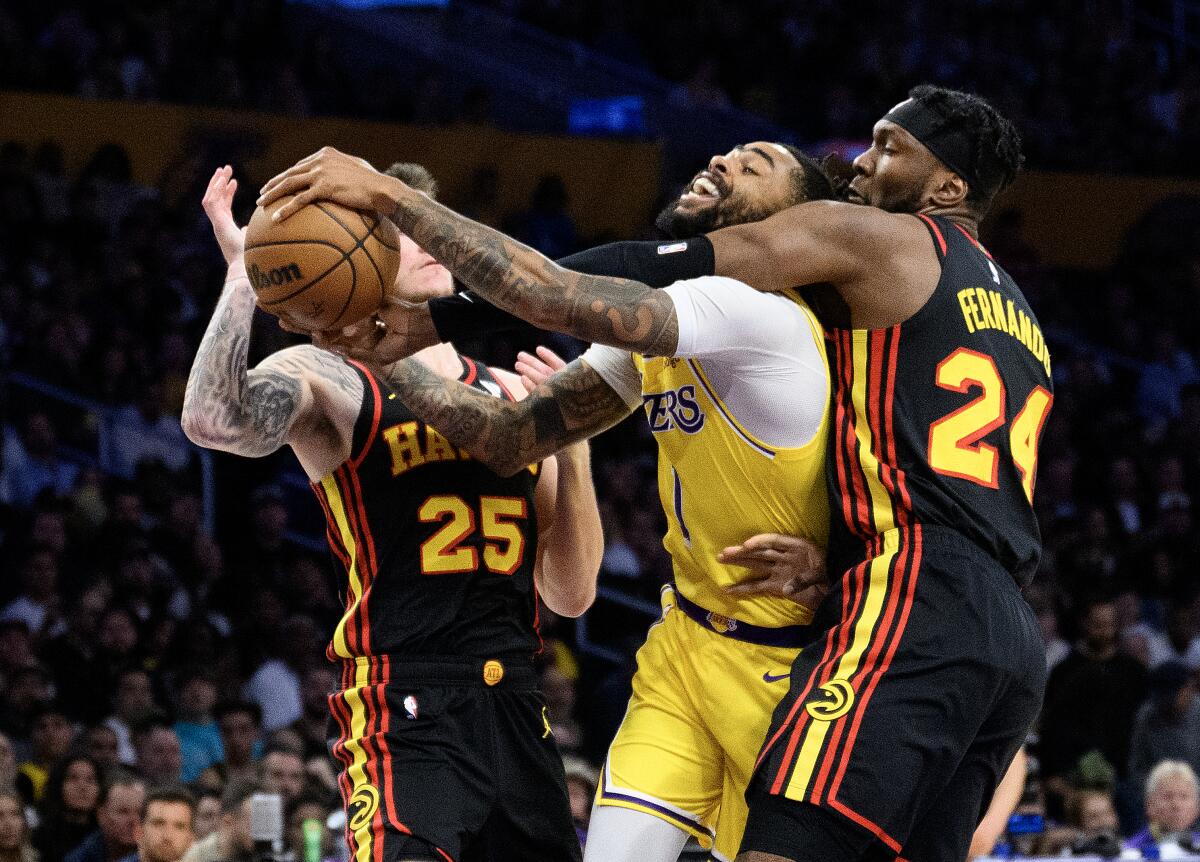 D'Angelo Russell is fouled by Bruno Fernando.