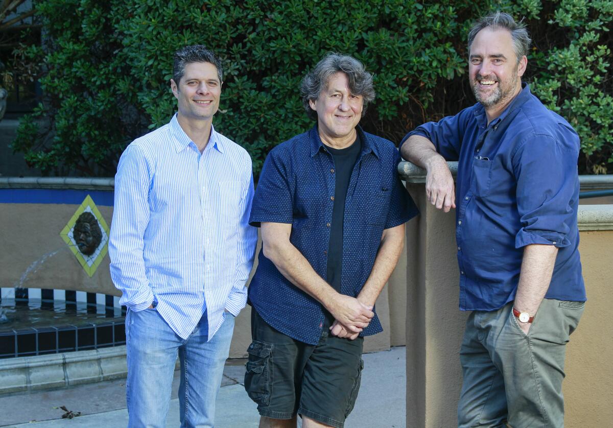 "Almost Famous" composer-lyricist Tom Kitt, writer-lyricist Cameron Crowe and director Jeremy Herrin (from left), photographed in Balboa Park.