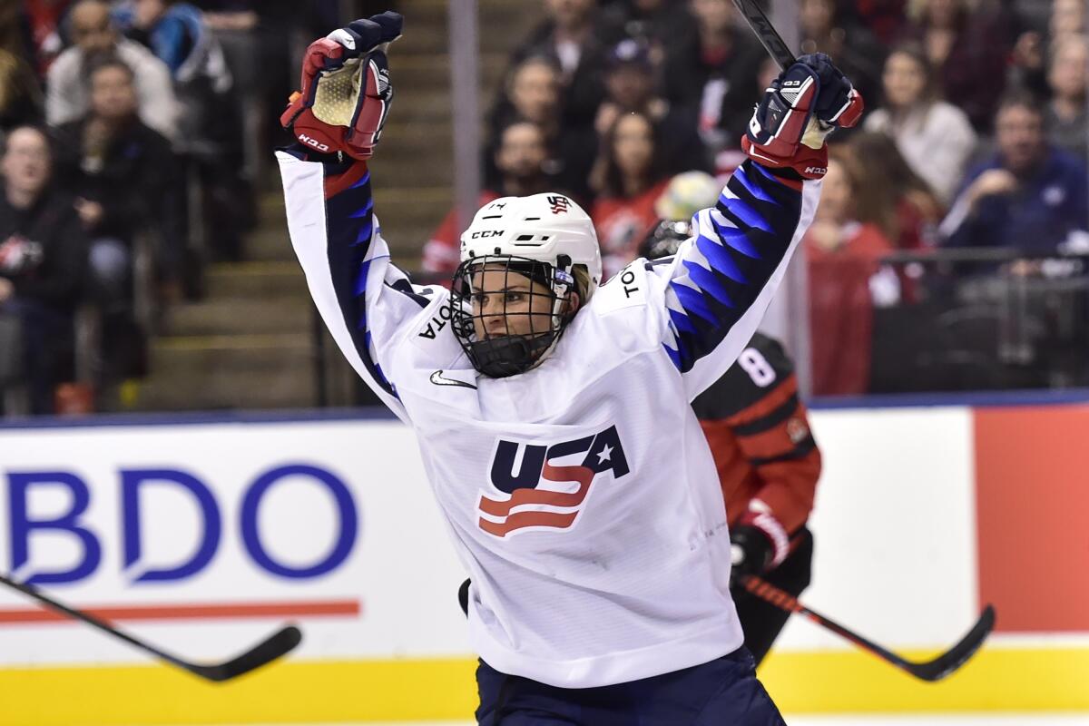 FILE - U.S. forward Brianna Decker (14) celebrates scoriung against Canada during the third period of a Rivalry Series hockey game in Toronto, in this Thursday, Feb. 14, 2019, file photo. Decker will enjoy a home-coming of sorts this weekend when the Professional Women’s Hockey Players’ Association holds its next Dream Gap Tour stop in Chicago. Decker grew up a Blackhawks fan and is looking forward to the opportunity to playing in Chicago’s United Center where she watched numerous games. (Frank Gunn/The Canadian Press via AP, File)
