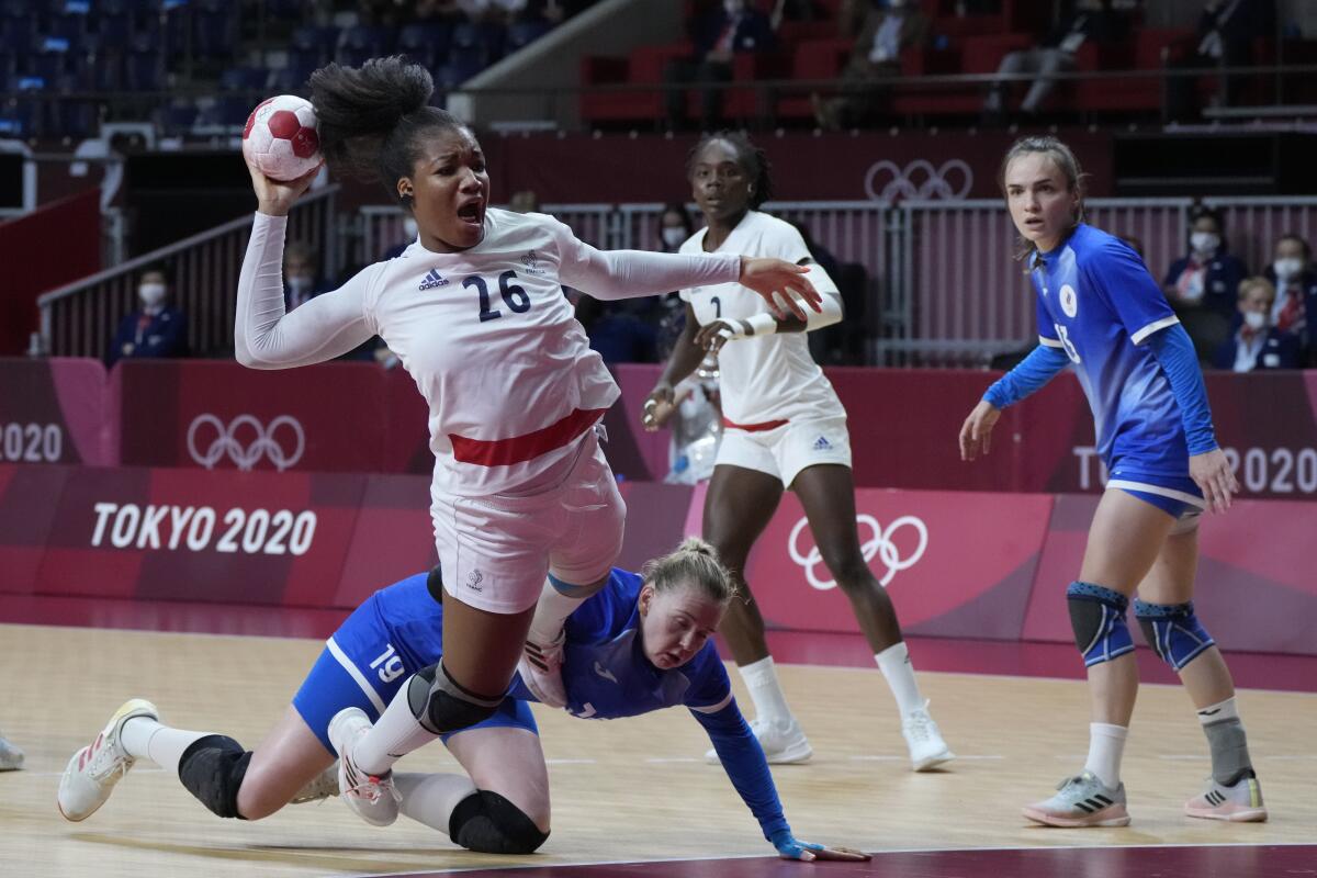 France's Pauletta Foppa scores a goal during the women's gold medal handball match between the Russian Olympic Committee and France at the 2020 Summer Olympics, Sunday, Aug. 8, 2021, in Tokyo, Japan. (AP Photo/Sergei Grits)