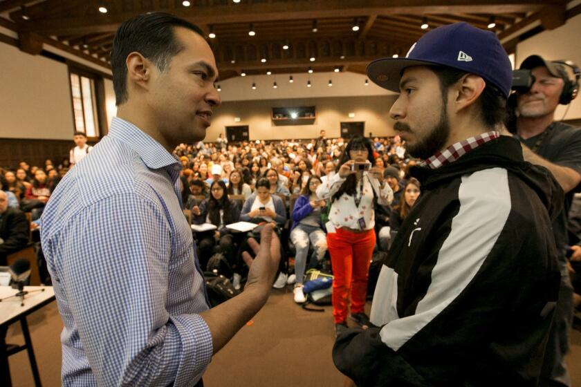 LOS ANGELES, CA MARCH 4, 2019: After Democratic presidential candidate Julian Castro, left, speaks with Alejandro Juarez, 22, right, moments before his lecture during a visit to a Chicano Studies class in Moore Hall auditorium at UCLA in Los Angeles, CA March 4, 2019. (Francine Orr/ Los Angeles Times)