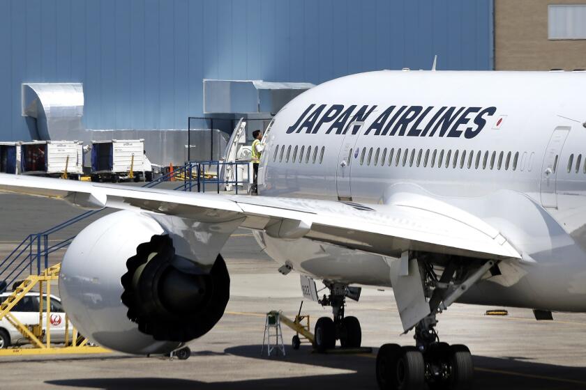A Japan Airlines Boeing 787 aircraft sits on the tarmac at Logan International Airport in Boston.