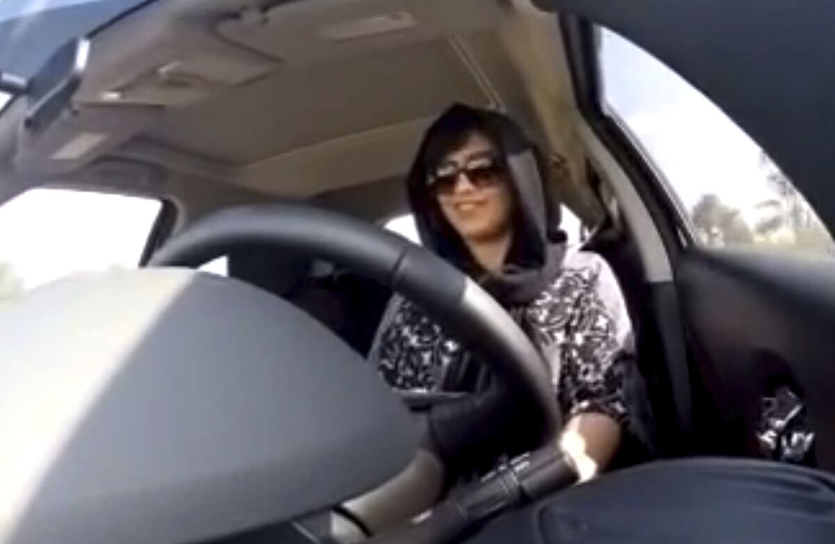 FILE - This Nov. 30, 2014, file photo made from video released by Loujain al-Hathloul, shows her driving towards the United Arab Emirates - Saudi Arabia border before her arrest on Dec. 1, 2014, in Saudi Arabia. Loujain al-Hathloul, a prominent Saudi political activist who pushed to end a ban on women driving in her country, is suing three former U.S. intelligence and military officials she says helped hack her cellphone so a foreign government could spy on her before she was imprisoned and tortured.AP Photo/Loujain al-Hathloul, File)