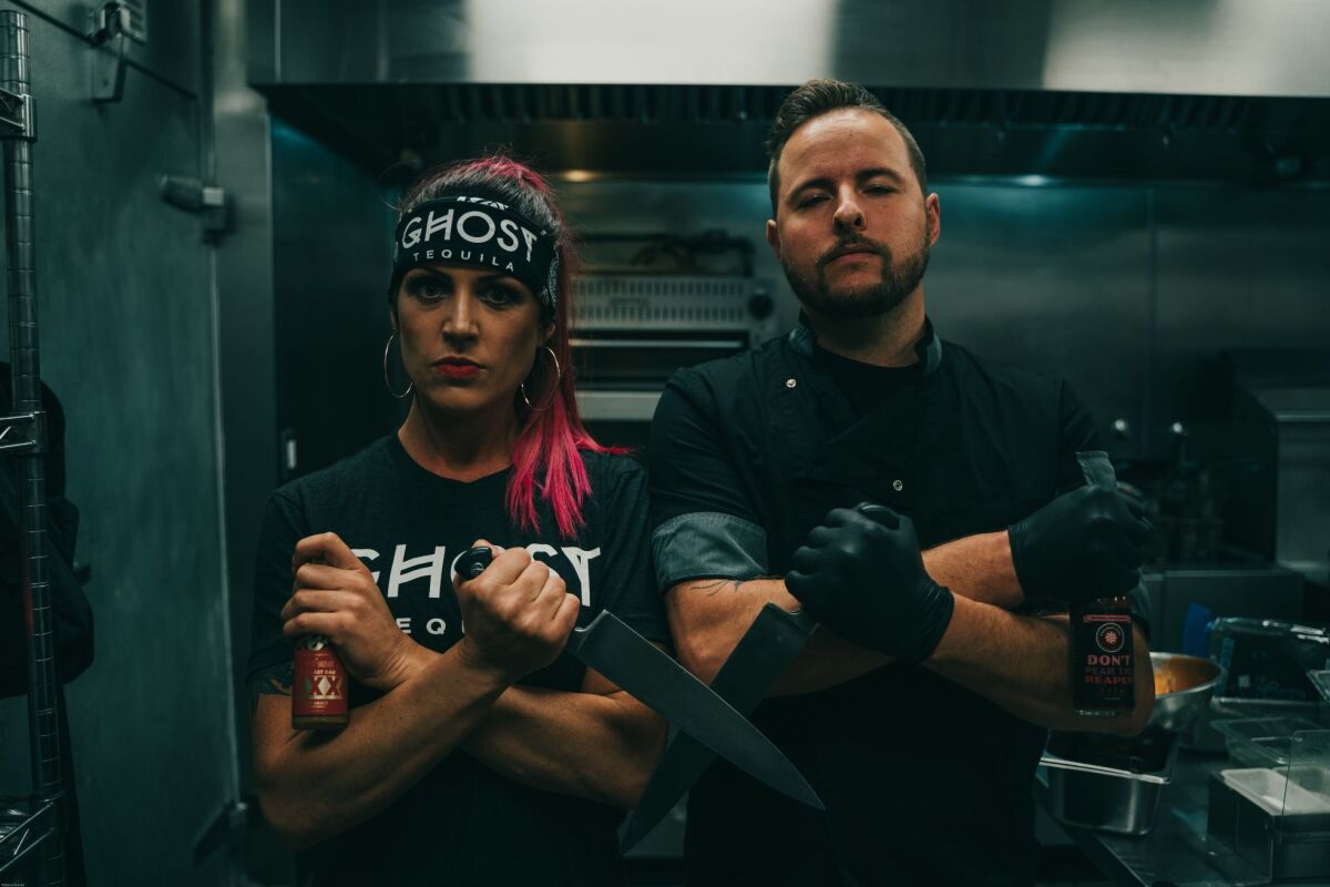 Vegan Danielle, left, and Grant Plummer are two of three partners of Good Distribution. Danielle will host the event and Grant Plummer will be preparing the wings.