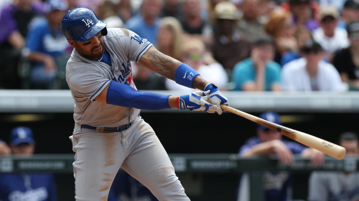 Dodgers left fielder Matt Kemp flies out during the fifth inning of the team's 5-4 loss in 10 innings to the Colorado Rockies on Saturday.
