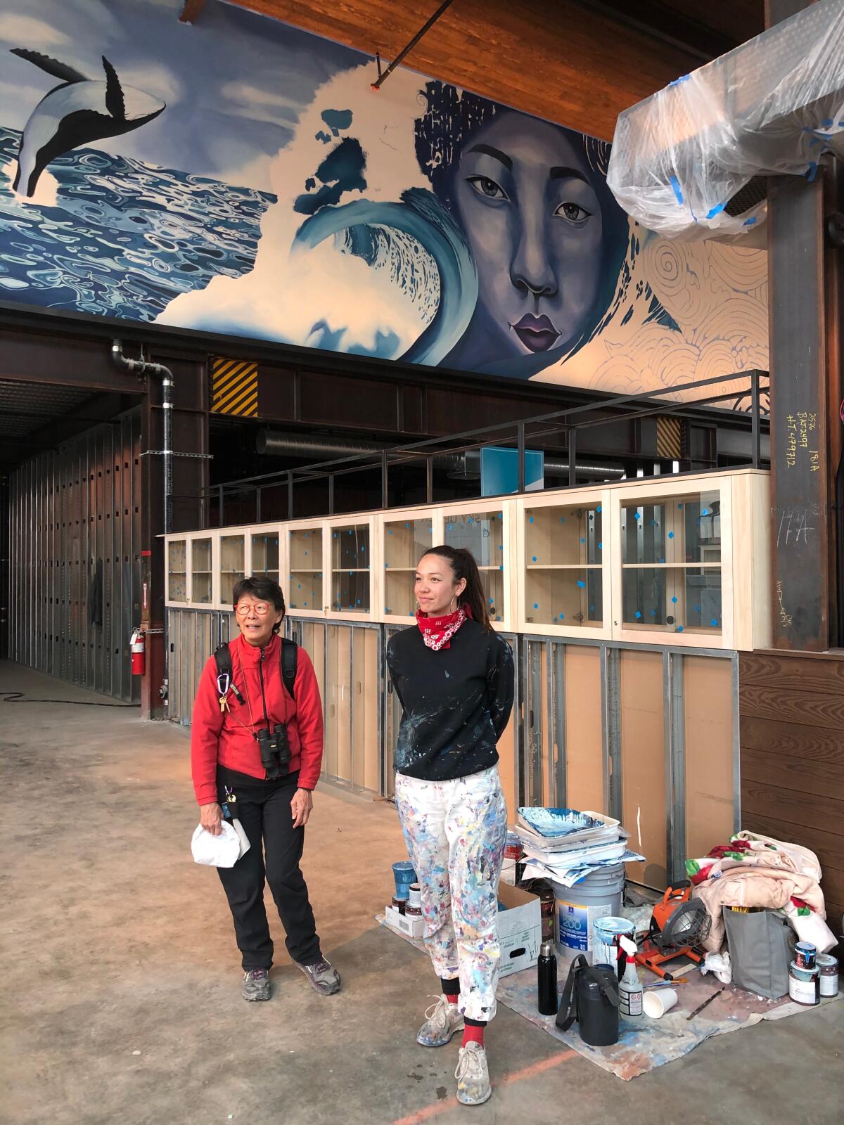 Mother and daughter Stephanie and Celeste Byers are featured in Aaron Glasson's mural at Little Lion Cafe in Ocean Beach.