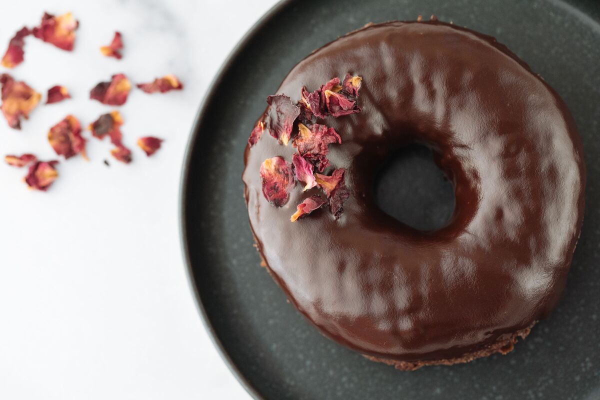 Sidecar's Red Wine Chocolate doughnut, sprinkled with edible rose petals.