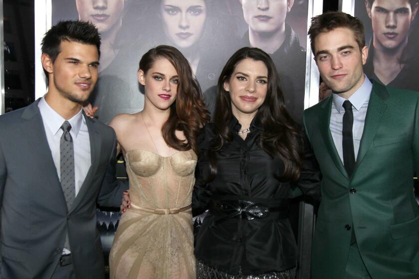 Stephenie Meyer, second from right, with "Twilight" stars Taylor Lautner, left, Kristen Stewart and Robert Pattinson. The author has penned her first thriller.