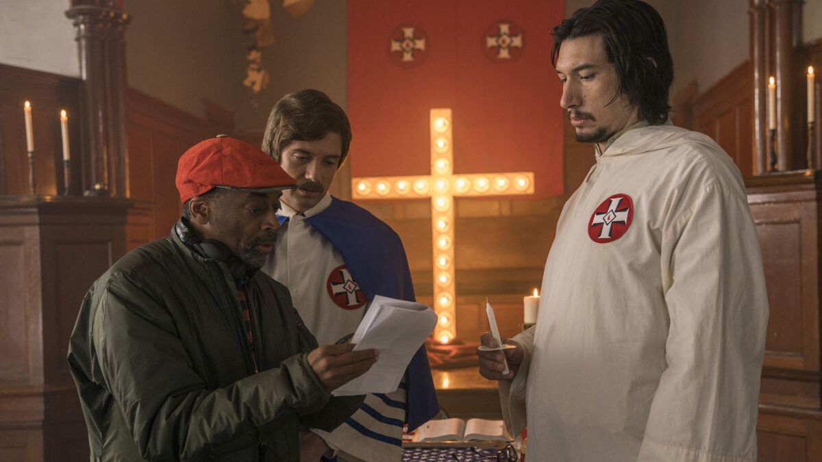 From left to right, director Spike Lee, actors Topher Grace and Adam Driver on the set of "BlacKkKlansman."