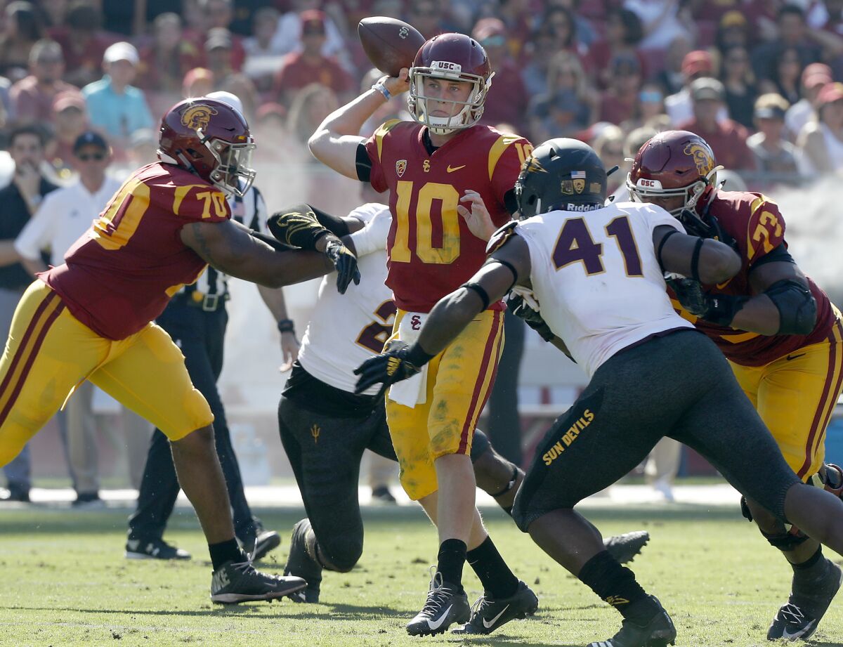 USC quarterback Jack Sears throws under pressure against Arizona State in the second quarter on Saturday.