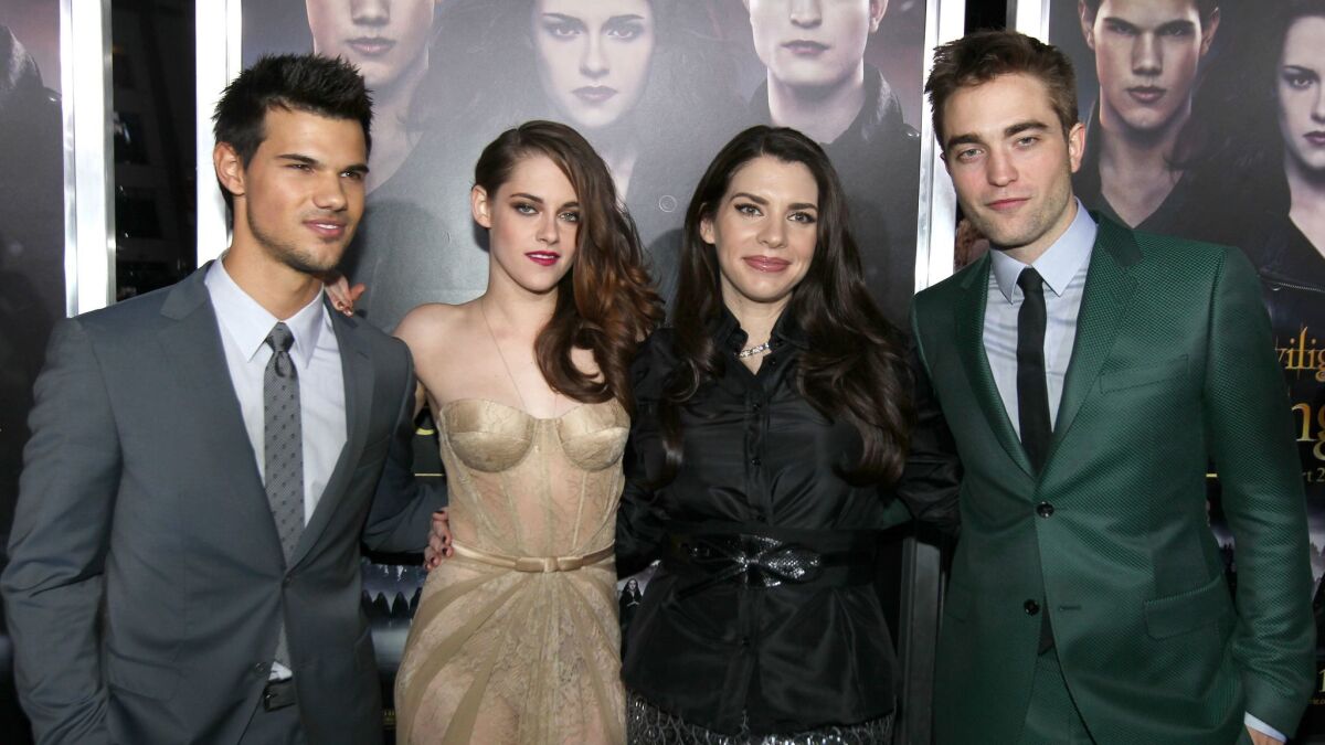 Stephenie Meyer, second from right, with "Twilight" stars Taylor Lautner, left, Kristen Stewart and Robert Pattinson. The author has penned her first thriller.