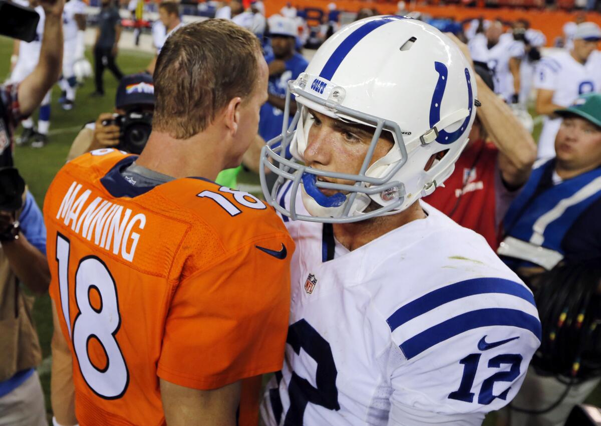 Peyton Manning and Andrew Luck share a moment after Sunday's game.