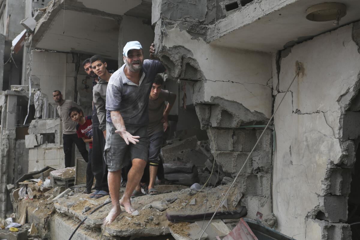 People inside a bombed building 