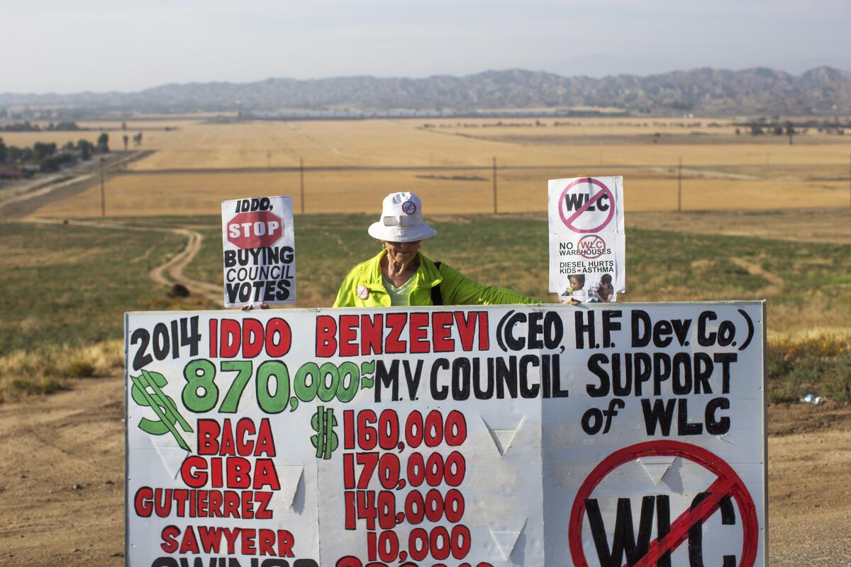 Riverside County resident Betty Masters opposes a proposed 40 million-square-foot warehouse for a World Logistics Center on land south of the 60 freeway and north of Redlands Boulevard in Moreno Valley on May 28.